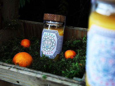 Sacred Orange bottle label design logo mayan photography