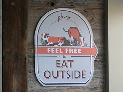 Eat Outside cows outdoor restaurant seating sign