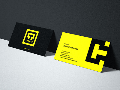 Tronier business cards big black bold logomark yellow