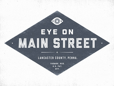 Eye on Main Street logo badge blue diamond eye eye on main street lancaster lancaster county patent pennsylvania projekt projekt inc. sean costik signage star texture vintage