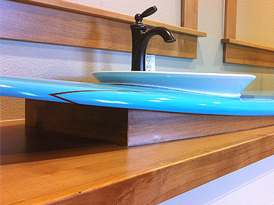 Surfboard Countertop blue bright bronze cabinets ceramic faucet furniture interiors mirror sink surf texture vanity wood