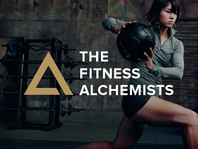 The Fitness Alchemists brand fitness gold logo symbol triangle white workout