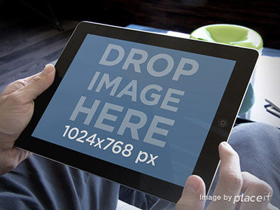 Black iPad held by a man app marketing ipad apps ux design