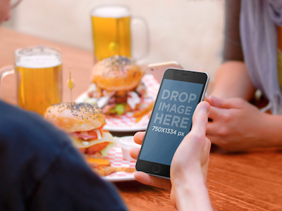 iPhone 6 Mockup of Friends Eating Out free mockup free psd iphone 6 iphone 6 mockup iphone 6 psd iphone template mockup psd template