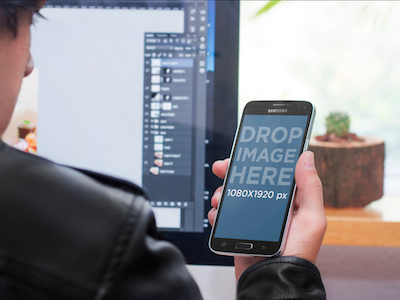 Designer Using Samsung S5 at The Office Mockup android apps app marketing business design mockup responsive screenshot generator samsung samsung galaxy samsung mockup startup marketing ui design ux design