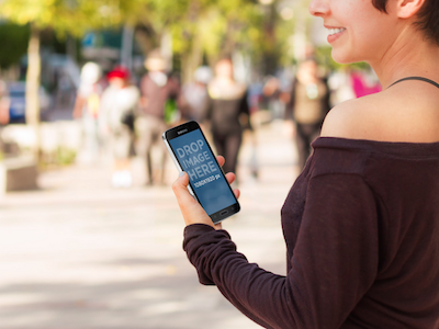 Samsung S5 Mockup - Girl Walking Outdoors Smiling And Having Fun