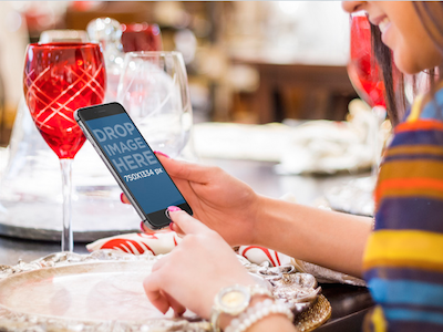 Portrait Mode iPhone 6 Mockup - Girl Using iPhone 6 at Dinner app marketing business design mockup ios apps iphone iphone 6 iphone mockup responsive screenshot generator startup marketing ui design ux design