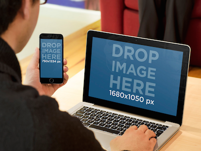 Man making a call with iPhone 6 while using Macbook Pro app marketing apple devices appstore graphic design ios apps iphone 6 iphone mockups macbook macbook mockups startup marketing startups