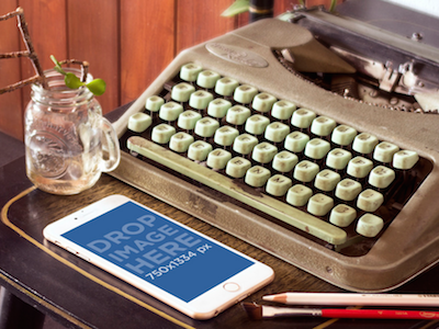 Mockup of Gold iPhone 6 Next to Vintage Typewriter