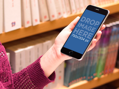iPhone 6 Plus Mockup of Girl Using iPhone 6 Plus at the Library