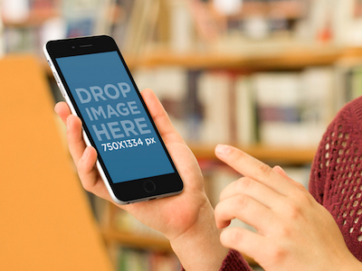 Mockup of Girl Using Black iPhone 6 at the Library app marketing apple devices appstore marketing ios apps iphone iphone 6 iphone 6 plus iphone apps seo startup marketing