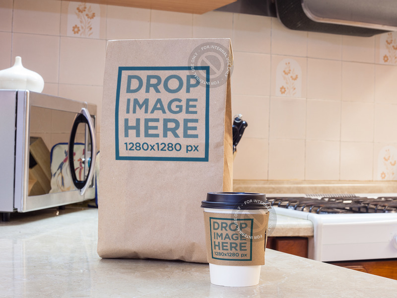 Download Takeaway Coffee Cup and Paper Bag on Top of a Kitchen ...