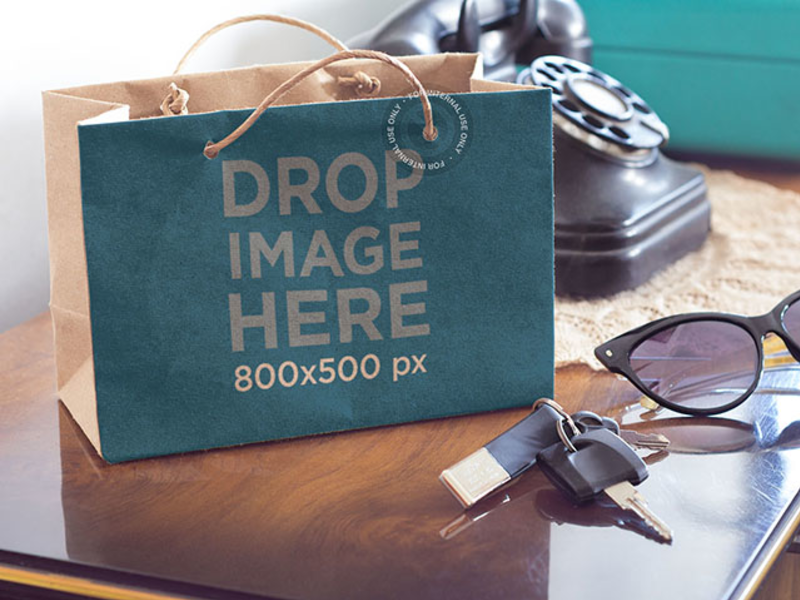 Download Paper Bag Mockup of a Shopping Bag Sitting on Top of a ...