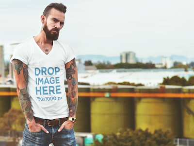 T-Shirt Mockup of a Tattooed Hipster Man at a Rooftop