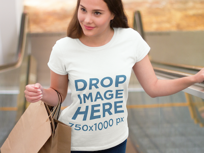 T-Shirt Mockup of a Girl at the Mall Doing Some Shopping digital marketing mockup generator mockup template mockup tools stock photo mockup stock photo template t shirt mockup t shirt mockup generator t shirt mockup template t shirt template visual marketing campaign web marketing