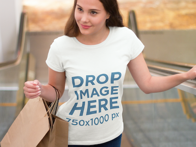T-Shirt Mockup of a Girl at the Mall Doing Some Shopping