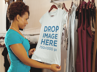 T-Shirt Mockup Featuring a Young Woman Shopping