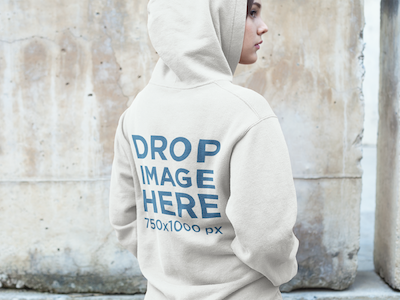 Hoodie Mockup of a Woman Standing in Front of a Wall clothing mockup clothing template hoodie mockup hoodie mockup generator hoodie mockup template hoodie stock photo hoodie template marketing tools mockup generator mockup template mockup tools visual marketing tools