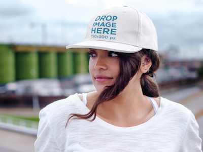 Hat Mockup of a Woman Standing on a Balcony mockup generator clothing mockup stock photo template stock photo mockup web marketing online marketing digital marketing tools visual marketing hat mockup template hat mockup generator hat template hat mockup