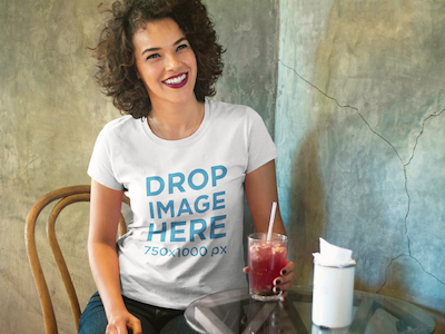 Woman Having a Drink at a Local Bar T-Shirt Mockup digital marketing mockup generator mockup template mockup tools stock photo mockup stock photo template t shirt mockup t shirt mockup generator t shirt mockup template t shirt template visual marketing campaign web marketing