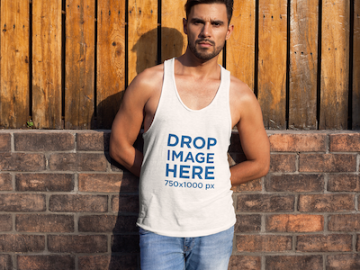 Man Standing in Front of a Wooden Fence Tank Top Mockup clothing mockup template content marketing digital marketing marketing tools mockup tools stock photo mockup stock photo template tank top mockup tank top mockup generator tank top mockup template tank top template visual marketing tools