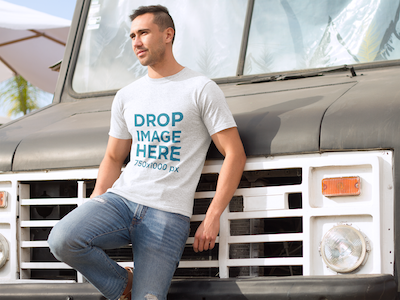 T-Shirt Mockup of a Young Man Leaning on an Old Truck digital marketing mockup generator mockup template mockup tools stock photo mockup stock photo template t shirt mockup t shirt mockup generator t shirt mockup template t shirt template visual marketing campaign web marketing