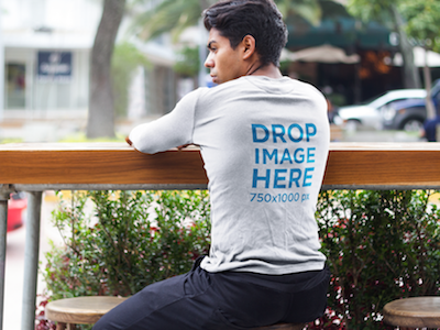 Young Man Sitting on a Stool Long Sleeve Tee Mockup