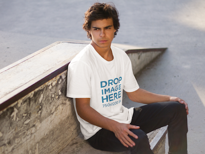 Download Young Man Sitting On A Concrete Bench T Shirt Mockup By Placeit On Dribbble