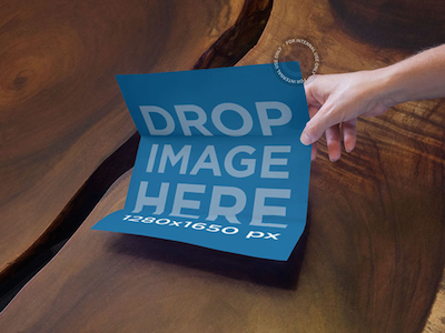 Mockup of a Person Grabbing a Brochure From a Coffee Table brochure mockup brochure mockup generator brochure mockup template brochure template digital marketing mockup generator mockup template mockup tools stock photo template web marketing
