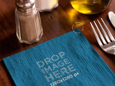 Branding Mockup Featuring a Napkin at a Restaurant Table