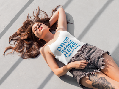 Young Tattooed Woman Lying on the Floor Tank Top Mockup clothing mockup template content marketing digital marketing marketing tools mockup tools stock photo mockup stock photo template tank top mockup tank top mockup generator tank top mockup template tank top template visual marketing tools