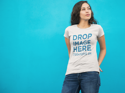 Woman Standing in Front of a Blue Wall T-Shirt Mockup