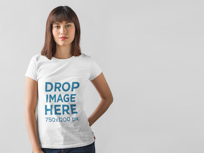 T-Shirt Mockup of a Young Woman Posing at a Photo Studio