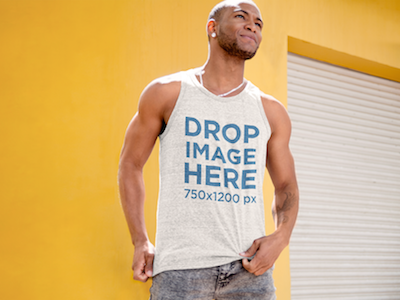 Tank Top Mockup of a Man Standing in Front of a Yellow Wall clothing mockup template content marketing digital marketing marketing tools mockup tools stock photo mockup stock photo template tank top mockup tank top mockup generator tank top mockup template tank top template visual marketing tools