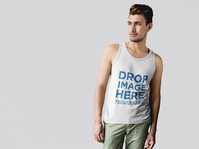 Tank Top Mockup of a Guy Standing in Front of a White Wall clothing mockup template content marketing digital marketing marketing tools mockup tools stock photo mockup stock photo template tank top mockup tank top mockup generator tank top mockup template tank top template visual marketing tools