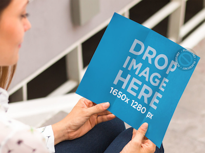 Brochure Mockup Featuring a Woman Sitting on a Stairway