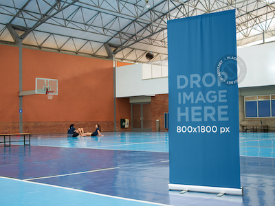 Vertical Banner Mockup at an Indoor Basketball Court