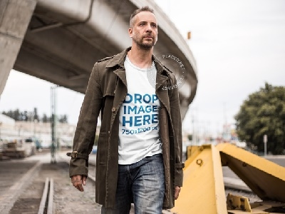 T-Shirt Mockup of a Man Walking Along a Railway