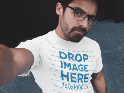 Hipster Guy with Glasses Taking a Selfie T-Shirt Mockup apparel clothing clothing brand clothing mockups marketing mockups t shirt tshirt tshirt mockup