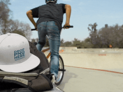 Snapback Hat Video Mockup of a Biker Boy at a Skatepark