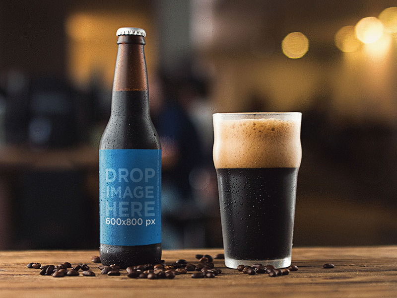 Mockup of a Stout Beer Bottle Next to a Glass