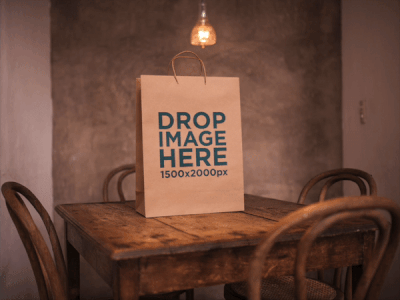Paper Bag Template on a Small Wooden Table Under a Lamp branding image marketing paper bag paper bag mockups photorealistic mockup print mockup print mockup generator print stock photo print template template web marketing