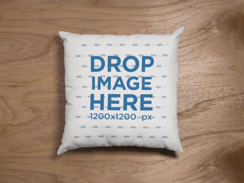 Mockup of a Square Pillow Lying on a Wooden Surface custom pillow image marketing photorealistic mockup pillow mockup pillow mockup generator pillow stock photo pillow template print print mockups template web marketing