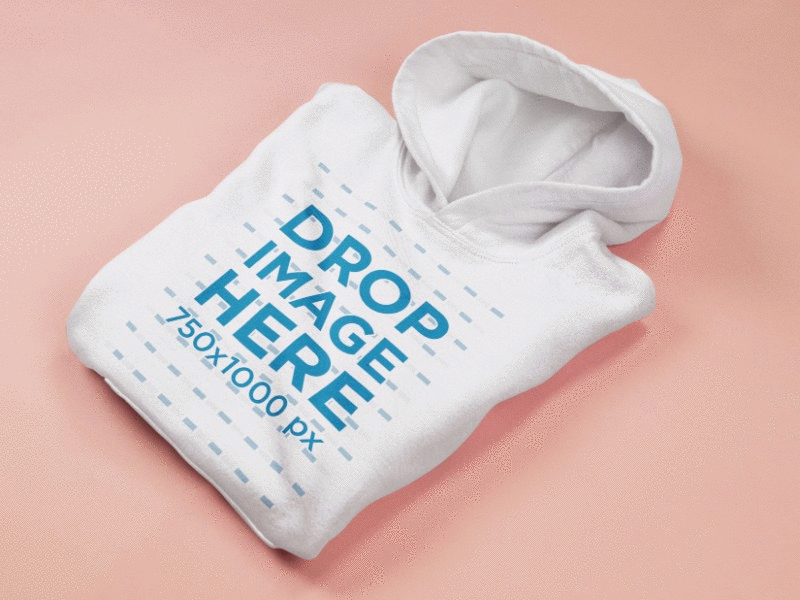 Folded Pullover Hoodie Mockup Lying on a Coral Pink Surface