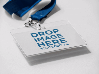 Angled Badge Holder Lying on a Solid Surface Mockup