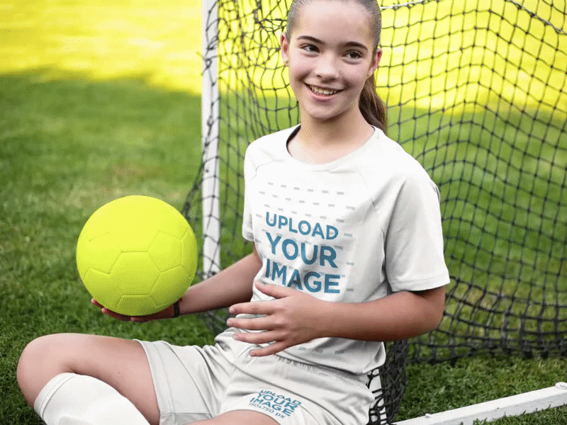 Custom Soccer Jerseys - Happy Girl Sitting Down with the Ball