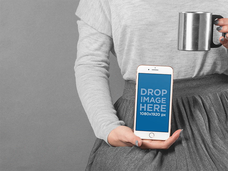 Woman Holding An Iphone Mockup And A Metal Cup app dev app development digital marketing digital mockup graphic design ios iphone iphone mockup ui ux