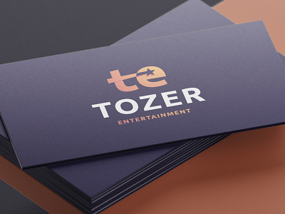 Tozer Entertainment - Logo Design entertainment lettermark logotype designer logotypedesign monogram letter mark negative space negativespace purple gradient shooting stars star logo t letter ubuntu