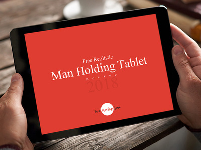 Free Realistic Man Holding Tablet Mockup