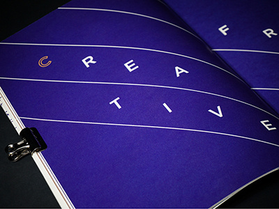 The Crossing blue creative editorial gold lines spread typography